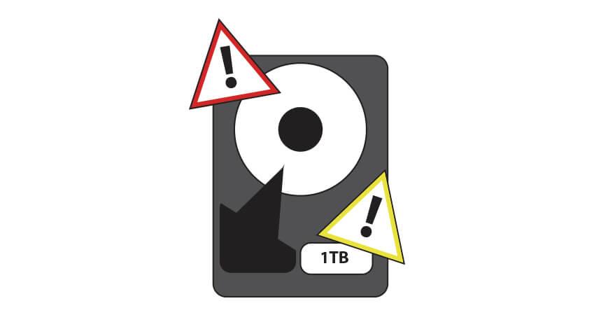 Graphical Image of hard drive with warning signs.